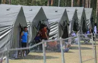 Мігранты ў лагеры для бежанцаў​